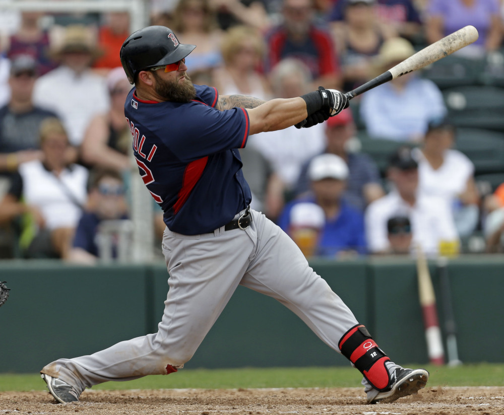 Boston’s Mike Napoli hits a solo homer in the sixth inning of an exhibition game against the Minnesota Twins in Fort Myers, Fla., on Friday.