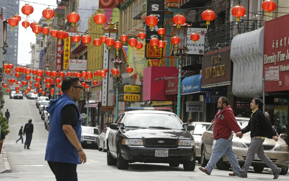 San Francisco police patrol the Chinatown district in San Francisco.
