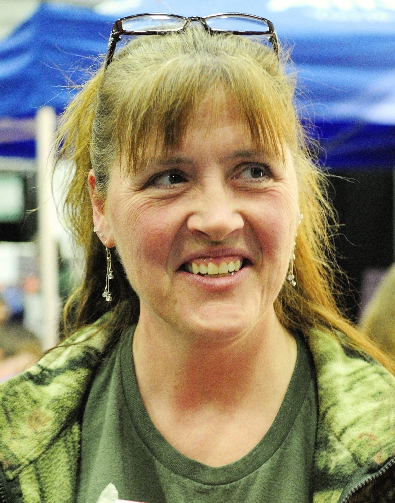 Lorri Nelson talks Saturday about the bear hunt referendum at the State of Maine Sportsman’s Show in the Augusta Civic Center.