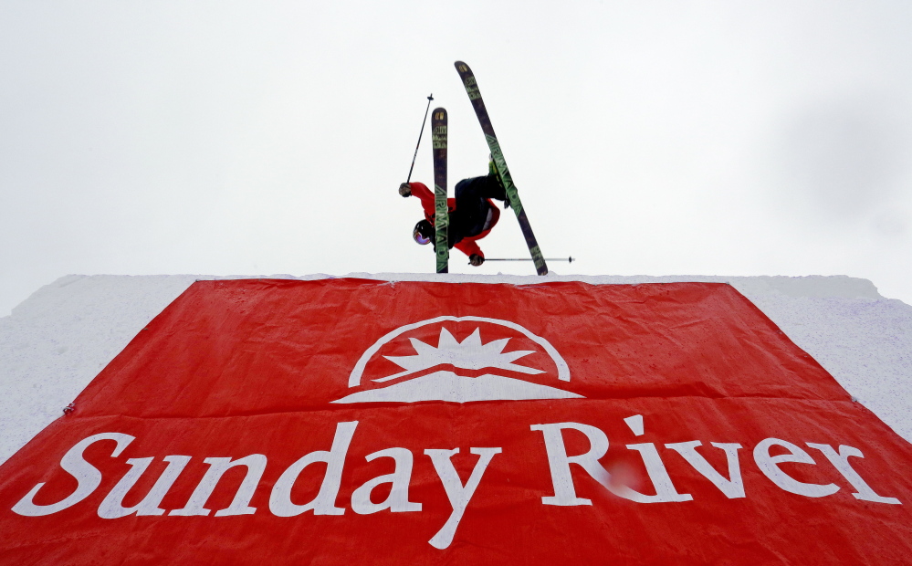 A skier crests the top of the first big jump at the 6th annual Dumont Cup at Sunday River Ski Resort in Newry on Friday.