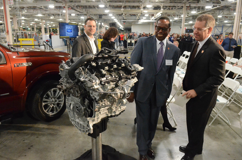 Joe Hinrichs, Ford president of The Americas, right, talks with Jimmy Settles, UAW vice president, at the Lima Ford Engine Plant in Lima, Ohio. UAW’s membership grew slightly last year.