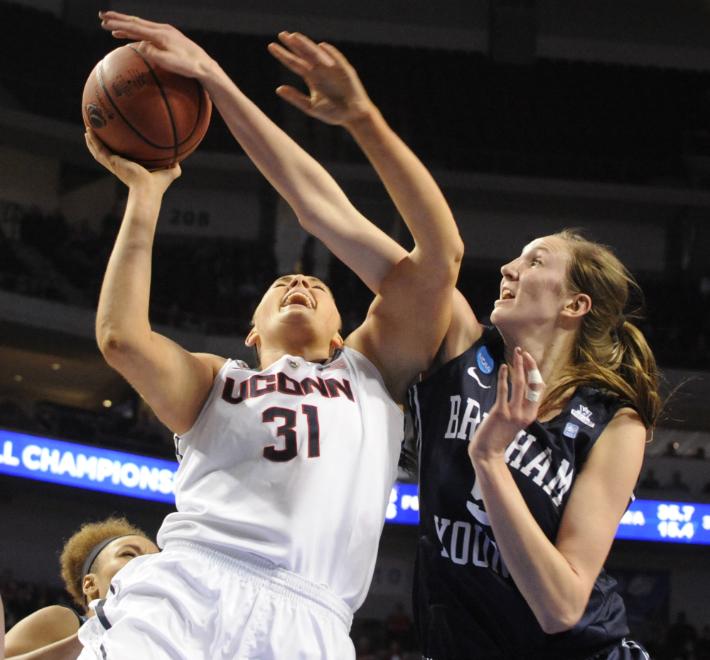 Connecticut’s Stefanie Dolson (31) takes a shot in front of BYU’s Jennifer Hamson (5) in the NCAA women’s basketball tournament Saturday.