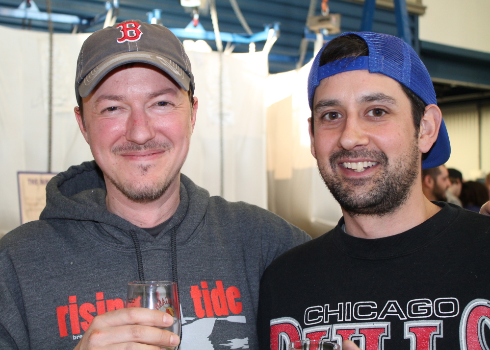 Sean Spence of Rising Tide Brewing, left, and Jack Perreault, of Allagash Brewing toast the new beer, Allagash Saison.