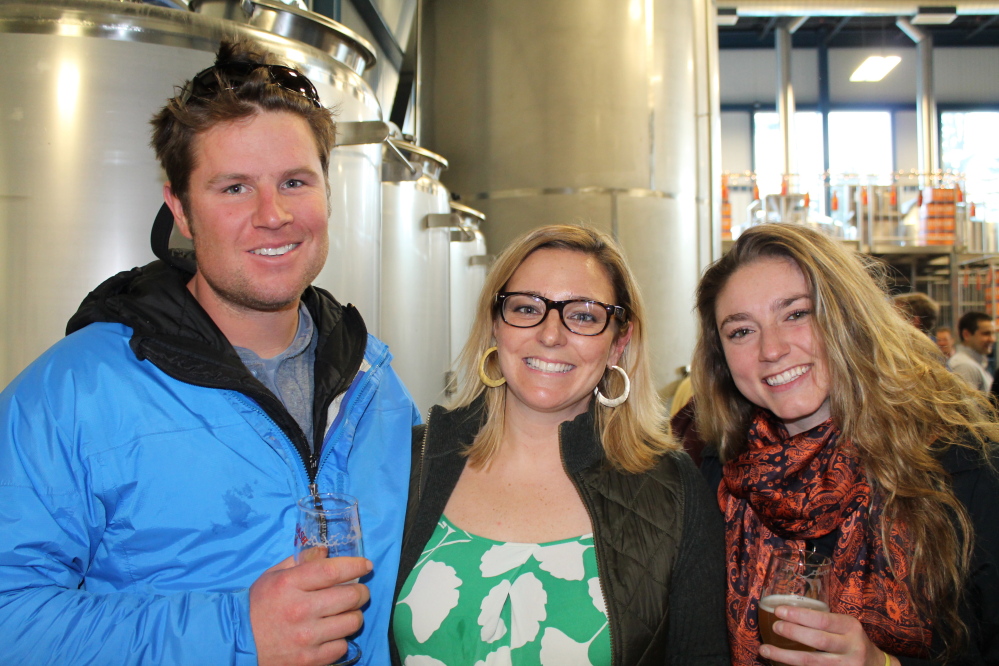 Scott Werner of Falmouth joins Mariah Nelson of Allagash Brewing Co. and Anna Vallely of Cape Elizabeth at the launch party at the brewery in Portland.