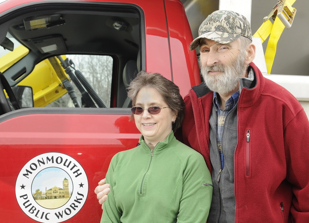Cathy Crocker poses with her husband, Leonard Crocker, beside a Monmouth Public Works truck on Friday at the town garage. Cathy Crocker learned only upon arriving at a Lewiston hospital that her husband had suffered a heart attack, not complications from diabetes.
