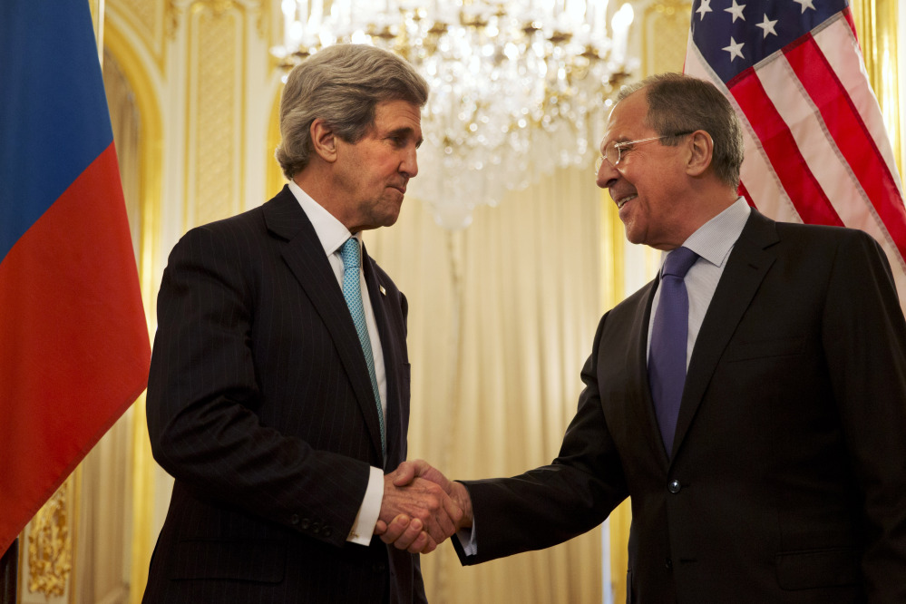 Secretary of State John Kerry, left, greets Russian Foreign Minister Sergey Lavrov before the start of their meeting about the situation in Ukraine in Paris on Sunday.