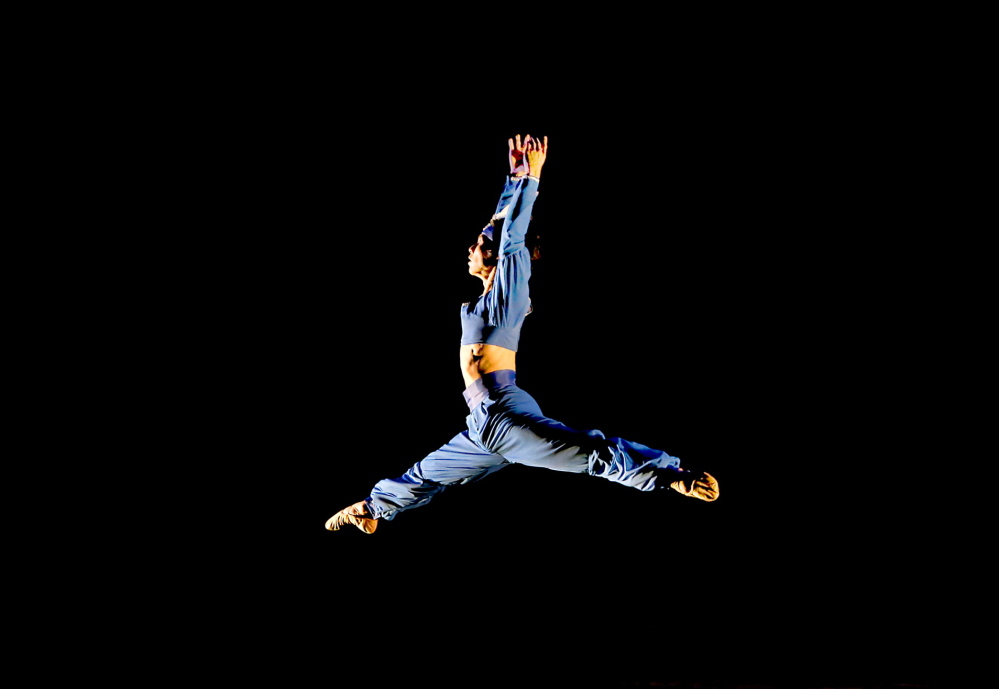 Junichi Fukuda leaps across the stage during the Portland Ballet performance of “Bolero to Bayadere” at the Westbrook Performing Arts Center on Saturday.