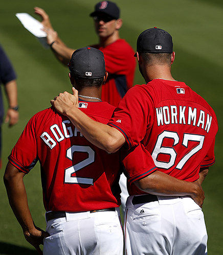 Xander Bogaerts and Brandon Workman are a pair of brothers in arms, as both moved up through Double-A Portland on their way to the major leagues. Here at spring training, they listen to a trainer in a warm-up session before an exhibition game at JetBlue Park.
