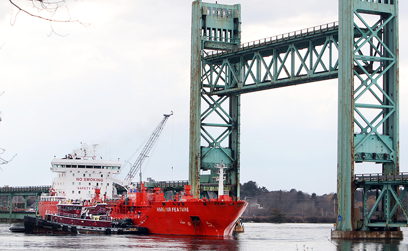 The 473-foot Harbour Feature rests against the Sarah Mildred Long Bridge on April 1, 2013, in Portsmouth, N.H.