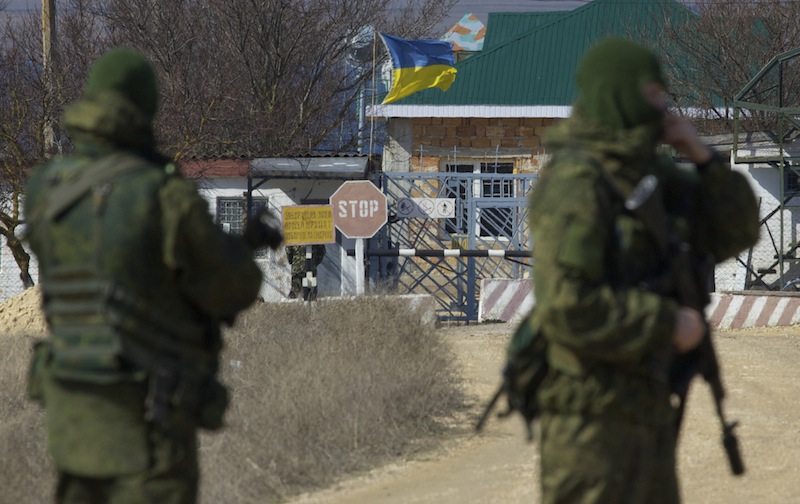 Pro-Russian soldiers block the Ukrainian naval base in the village of Novoozerne, some 91 kilometers west of Crimean capital Simferopol, Ukraine, on March 3. Ukraine announced plans Wednesday for mass troop withdrawals from the strategic peninsula.