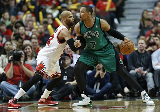 Chicago Bulls forward Taj Gibson, left, defends against Celtics center Jared Sullinger on Monday in Chicago. The Bulls won 94-80.