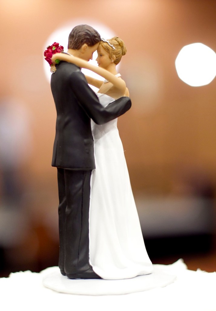 Figurines of a bride and a groom sit atop a wedding cake in Raleigh, N.C. A study of more than 3.5 million Americans finds that married people are less likely than singles, divorced or widowed folks to suffer any type of heart or blood vessel problem. The results were released Friday.