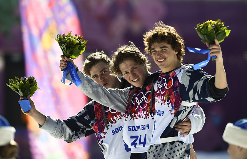 U.S. finalists second-placed Gus Kenworthy, winner Joss Christensen and third-placed Nicholas Goepper (L-R) celebrate on podium after the men's freestyle skiing slopestyle finals at the 2014 Sochi Winter Olympic Games in Rosa Khutor, February 13, 2014.