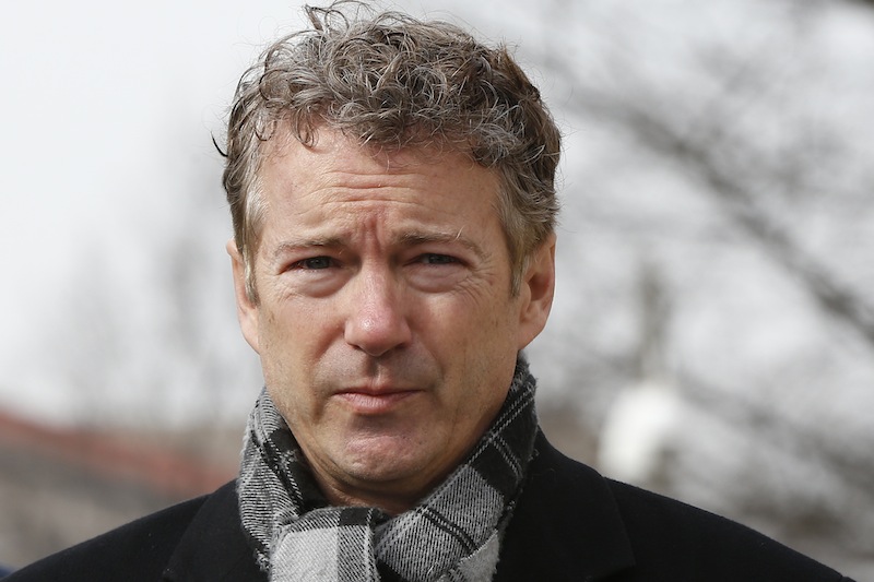In this Feb. 12, 2014 file photo, Sen. Rand Paul, R-Ky., walks towards waiting reporters in front of federal court in Washington. Paul's biggest political decision is approaching: whether to run for president in 2016 or focus solely on re-election to his U.S. Senate seat. But a new bill could free him from that dilemma.