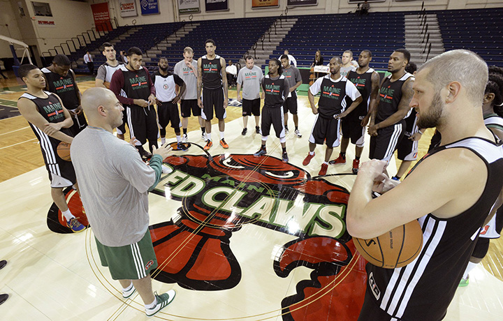 In this Nov. 8, 2013, photo, Red Claws Coach Mike Taylor starts team practice after the team's media day at the Portland Expo. RedClaws