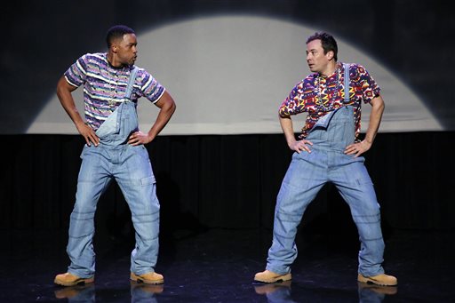 In this image released by NBC, Will Smith, left, and host Jimmy Fallon act out the evolution of hip-hop dancing on the premiere of "The Tonight Show Starring Jimmy Fallon." NUP_162877;select