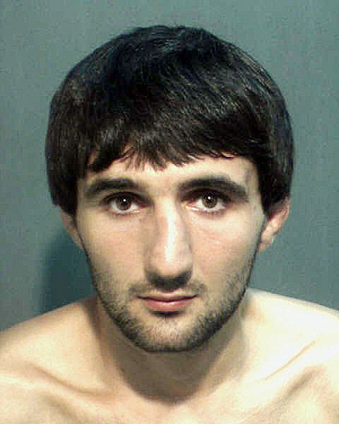 This is a May 4, 2013, police photo provided by the Orange County Corrections Department in Orlando, Fla., showing Ibragim Todashev after his arrest for aggravated battery in Orlando. He was fatally shot on May 22, 2013, when he initiated a violent confrontation, FBI officials said.