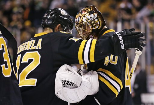 Boston Bruins goalie Tuukka Rask is congratulated by right wing Jarome Iginla after they defeated the Minnesota Wild in Boston on Monday night.