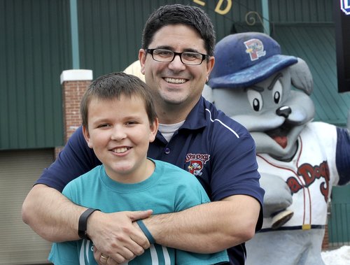 Justin LeBlanc, who animated Slugger for the first three years of the franchise’s existence in Portland, will walk with the Sea Dogs mascot from Fenway to Hadlock to raise funds for children with Tourette’s syndrome. With him is son Theo, who has Tourette’s.
