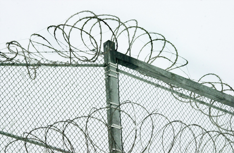 Razor wire is coiled at the top of the security fence at the Maine State Prison facility in Warren. A PBS documentary on solitary confinement in the U.S. will include Maine’s progression on reducing its use.