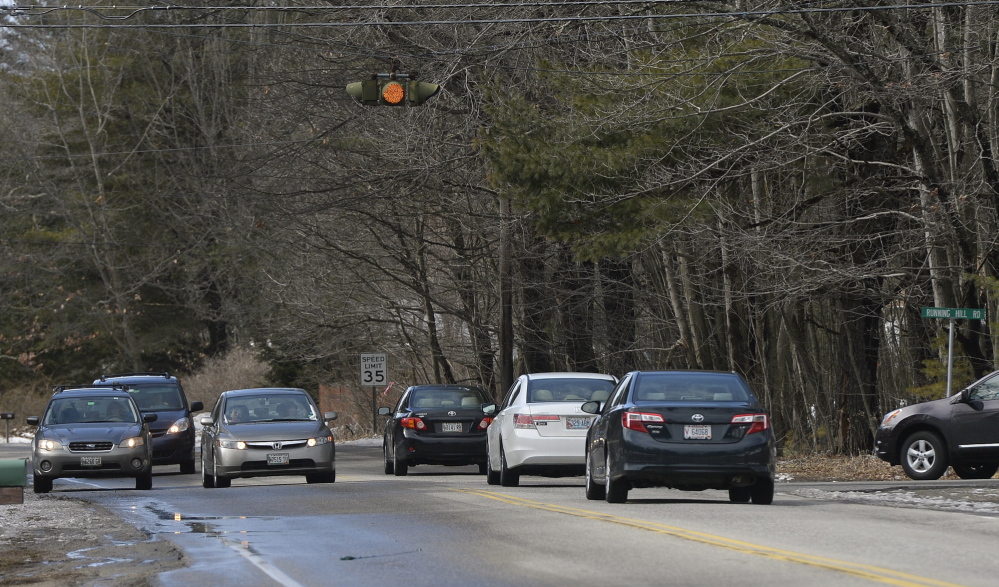 SCARBOROUGH, ME - March 31: A car tries to make a left hand turn onto Running Hill Rd. from Route 114 in Scarborough Monday, March 31, 2014. (Photo by Shawn Patrick Ouellette/Staff Photographer)