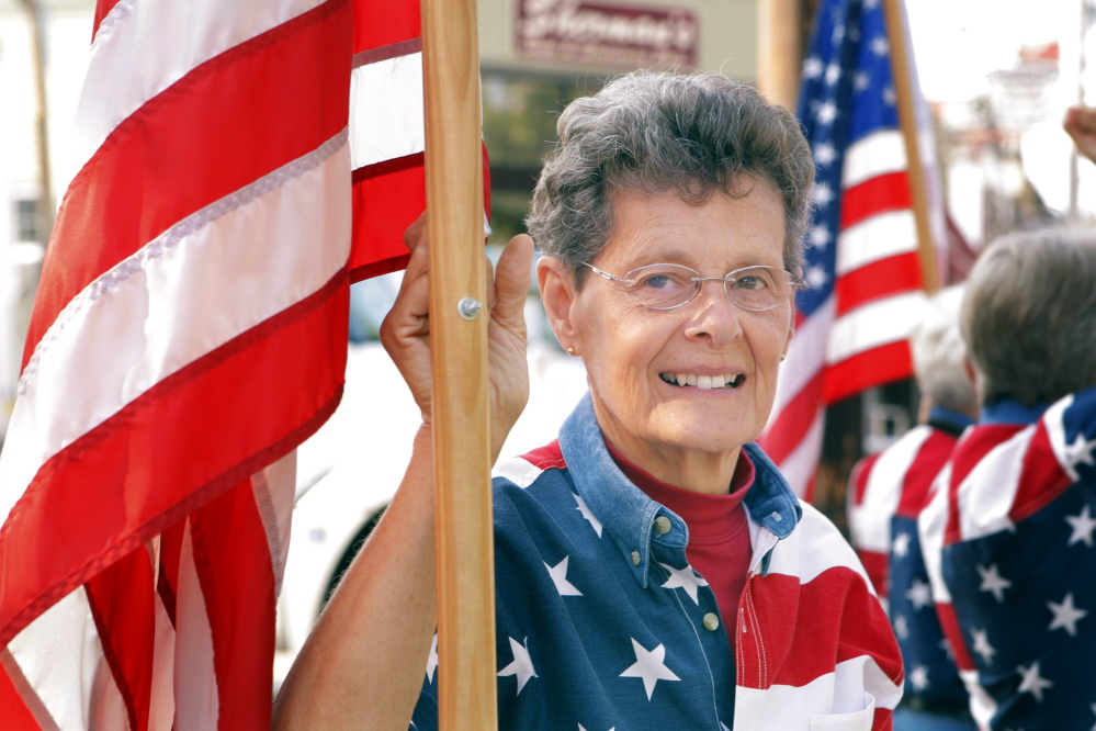 Carmen Footer is one of the Freeport Flag Ladies who have met on Main Street in Freeport every Tuesday since September 11, 2001.