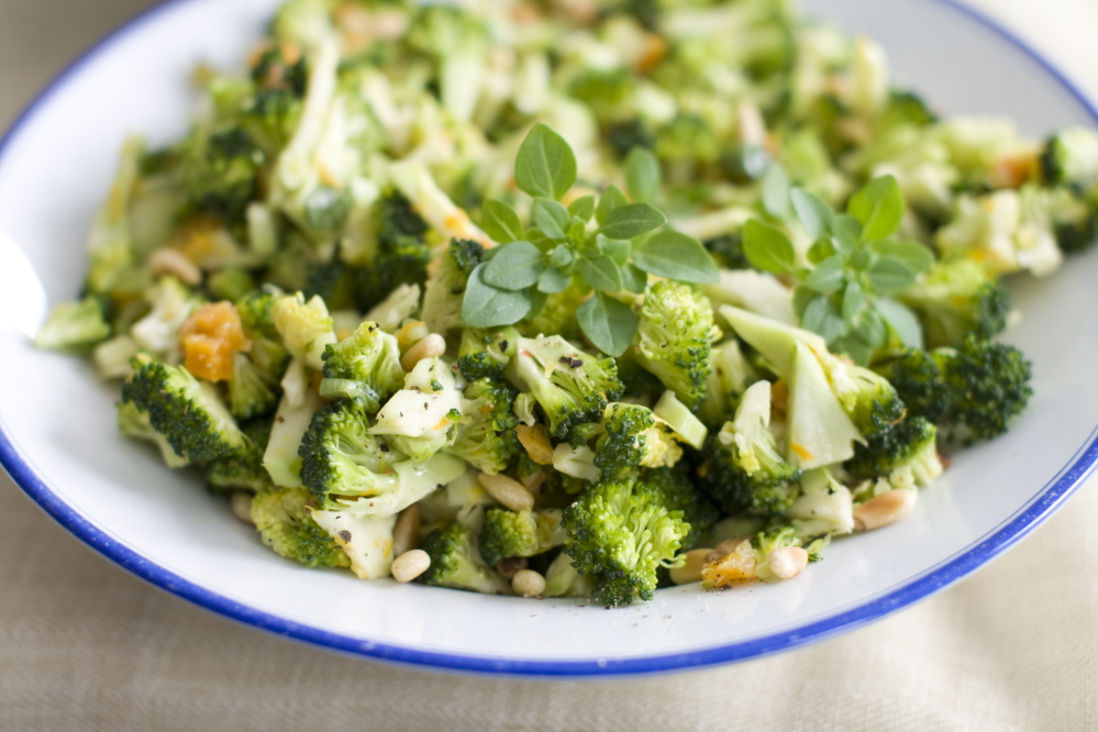 Chopped dried apricots add a sweet touch to Citrus-Pine Nut Broccoli Slaw.