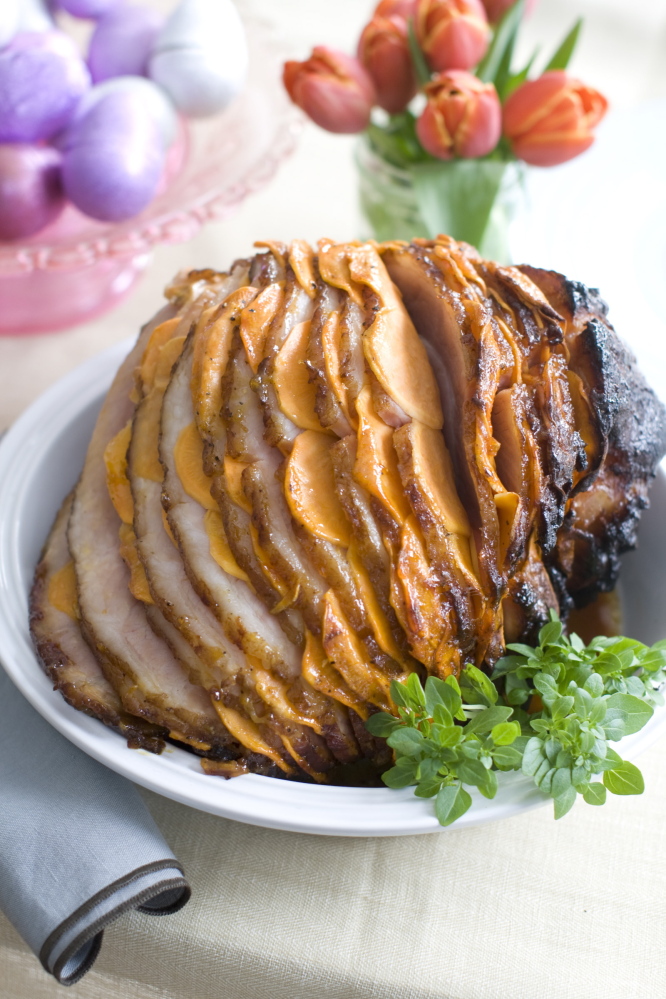 Glazed Sweet Potato Stuffed Ham is glazed with apricot preserves mixed with black pepper.