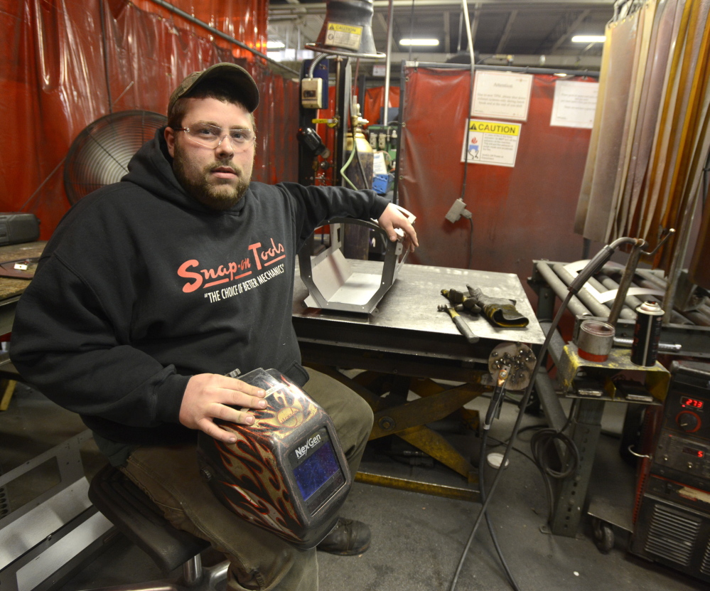 Ryan Villineau is a welder at the Jotul factory in Gorham. He completed a one-year certificate program at SMCC.