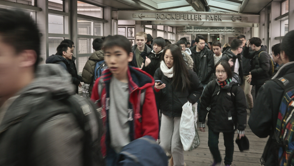 In this March 25, 2014, students leave Stuyvesant High School in New York City. Asian children have the best chance of success based on an index that incorporates reading and math proficiency, high school graduation data, teen birthrates, employment prospects, family income and education levels, and neighborhood poverty levels.