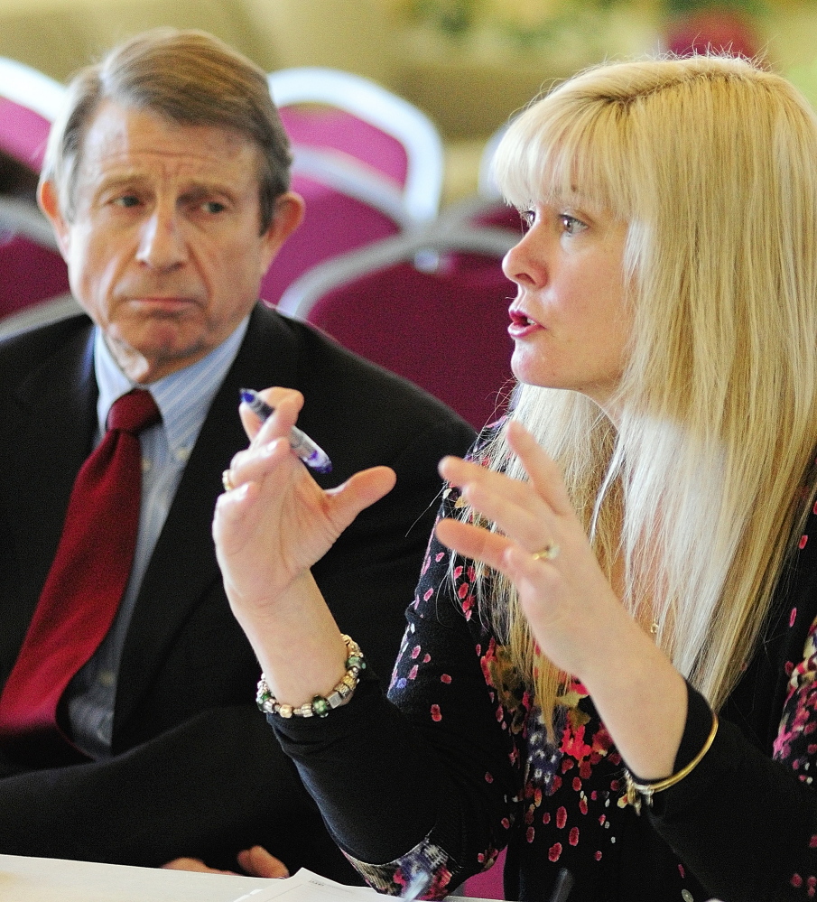 Maine Virtual Academy board secretary Peter Mills, left, listens as board chairwoman Amy Carlisle answers a question from the state Charter School Commission in February during an interview at University of Maine at Augusta.