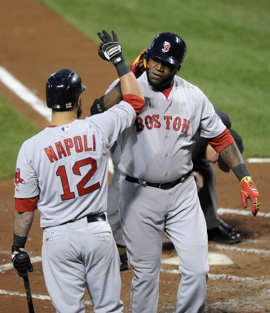 Boston Red Sox designated hitter David Ortiz, right, celebrates his two-run home run with Mike Napoli during the third inning of Wednesday's game against the Baltimore Orioles.