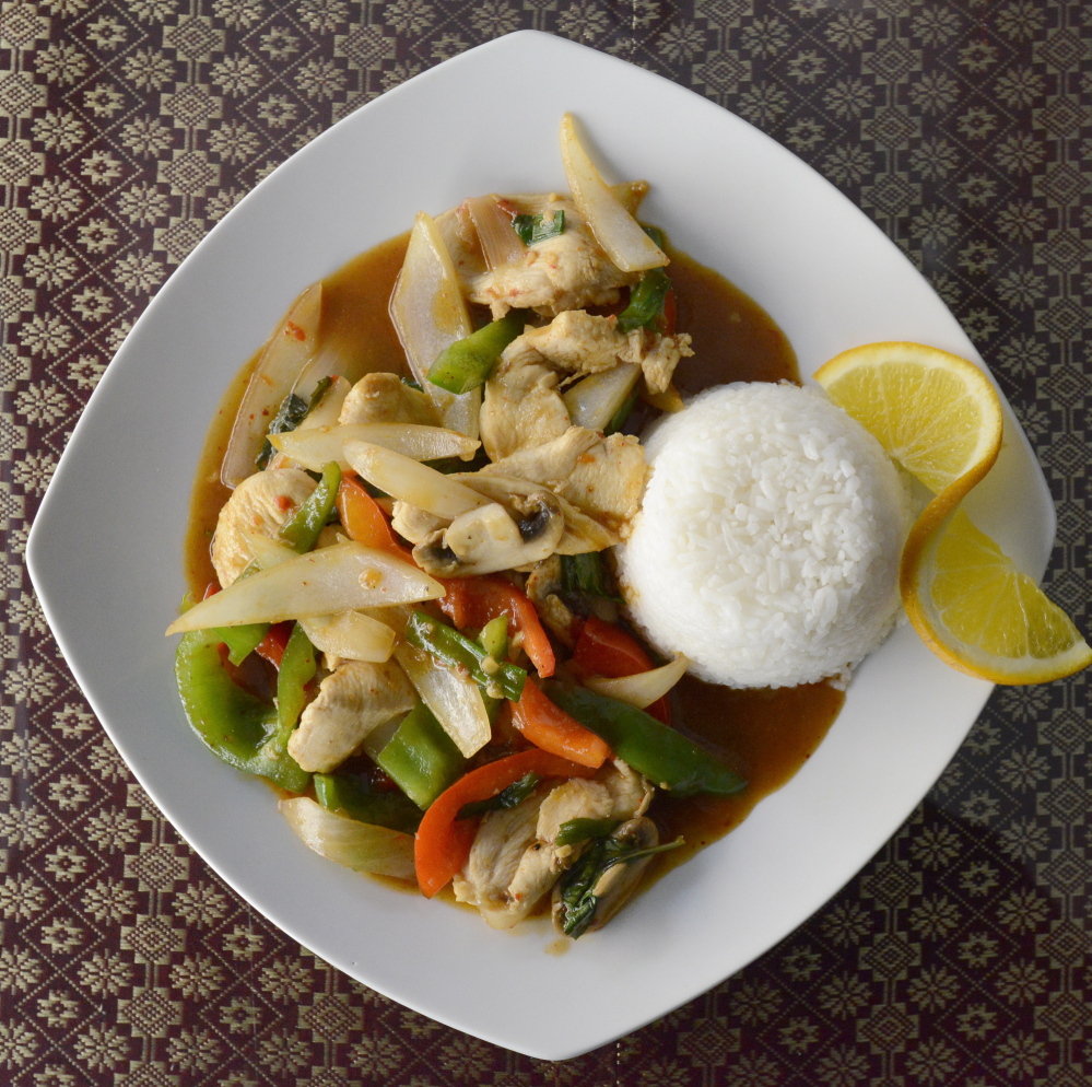 Thai 9’s basil stir-fried chicken with mushroom, carrot, snow peas, broccoli, zucchini and onion in a light garlic sauce.