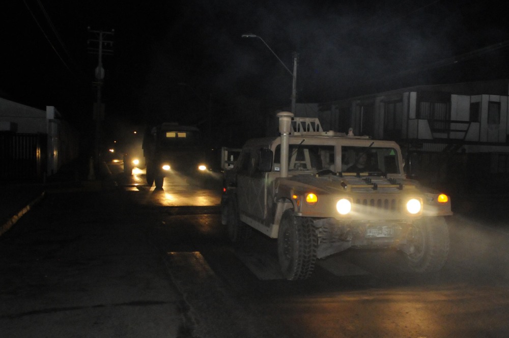 A military vehicle patrols in Iquique, Chile, after an earthquake in Tuesday set off a small tsunami that forced evacuations along the country’s entire coast.