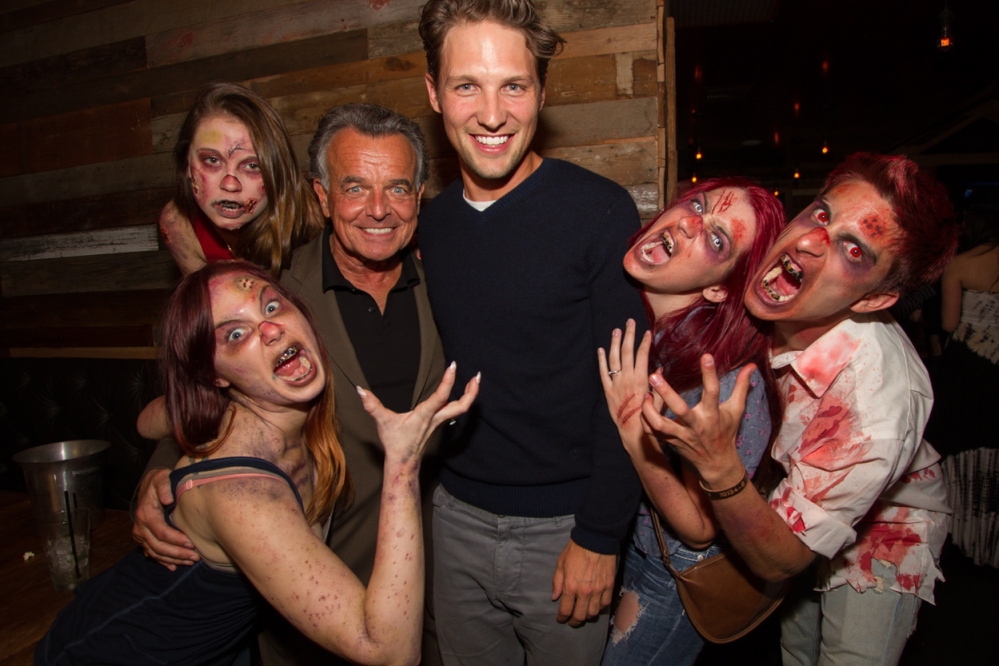 Kyle Rankin, center, with actor Ray Wise and undead friends.