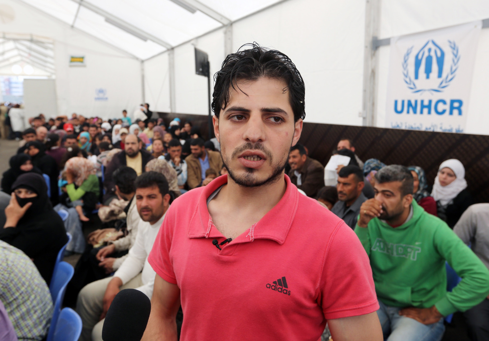 Syrian refugee Yahya speaks to journalists at the United Nations High Commissioner for Refugees registration center in the northern city of Tripoli, Lebanon, on Thursday. The teenager from central Syria became the 1 millionth Syrian refugee to register in Lebanon.