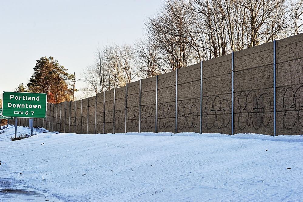 Graffiti covers the sound barrier along Interstate 295 in South Portland.