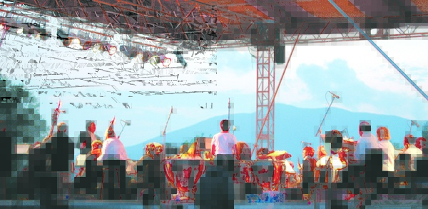 The Bangor Symphony Orchestra plays at the annual Kingfield POPS concert with the western mountains as a backdrop.