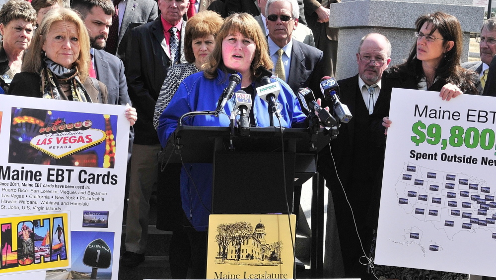 Rep. Sharri MacDonald, R-Old Orchard Beach, stands with fellow Republican legislators during a news conference on welfare reform bills on Friday at the State House.