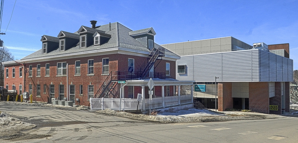 The Haynes Building at the corner of St. Catherine and East Chestnut Streets, left, just up hill from the former MaineGeneral Medical Center is seen in this photo taken on Friday in Augusta. The Muskie Center of Public Policy will move there from the Central Maine Commerce Center in north Augusta.