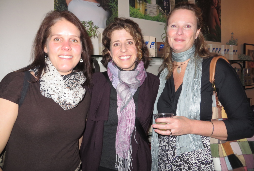 Biz Brewer, Ashley Wernher-Collins and Claire Depke, all of Cape Elizabeth, at the opening reception.