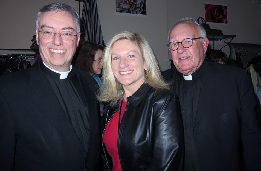 Father Marc Caron with Deb Coppinger, parish secretary at Parish of the Holy Eucharist in Yarmouth, and Monsignor Charles Murphy at the Maine Jewish Film Festival opening reception before the showing of “The Jewish Cardinal” at the Nickelodeon.