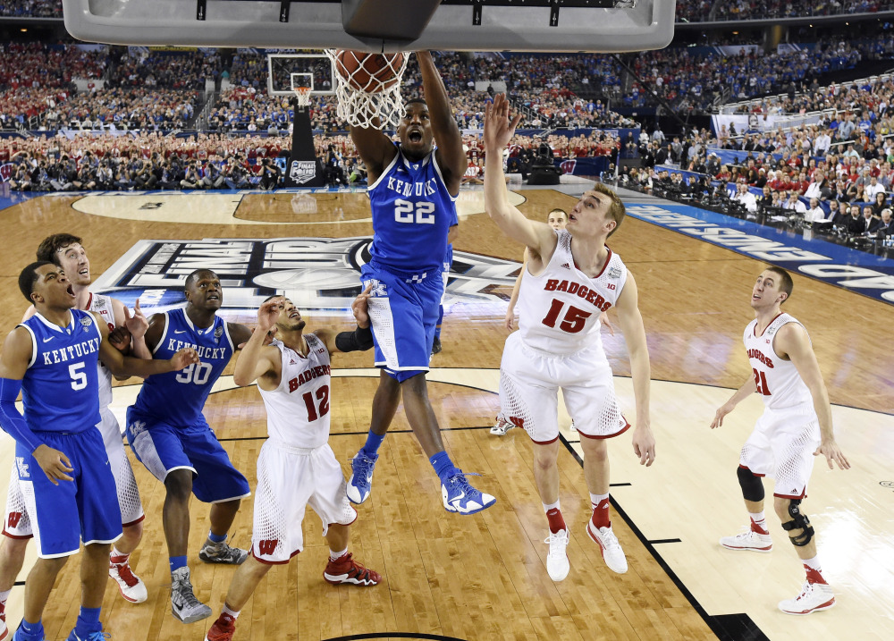 Kentucky forward Alex Poythress (22) dunks against Wisconsin during the second half of the NCAA Final Four semifinal game Saturday in Arlington, Texas.