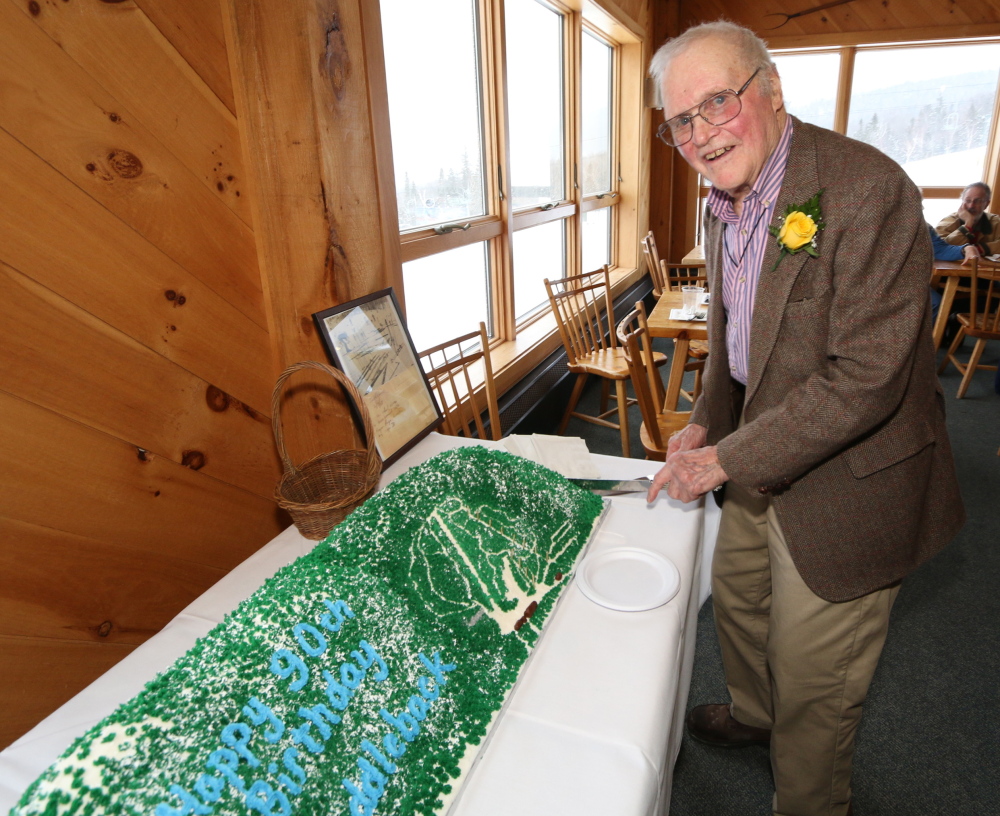 Roger Page cuts his 90th birthday cake during festivities in his honor at Saddleback Mountain, where his ambition of operating a ski school came to fruition decades ago.