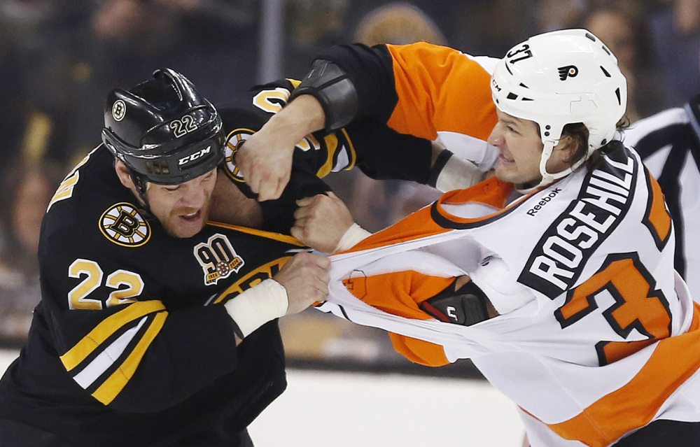 Shawn Thornton of the Bruins fights with Philadelphia’s Jay Rosehill in the first period Saturday at Boston.