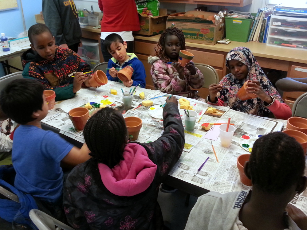 Kids at the Riverton Park Boys and Girls Club prepare painted pots during a recent Kids in the Kitchen event led by Junior League of Portland volunteers.