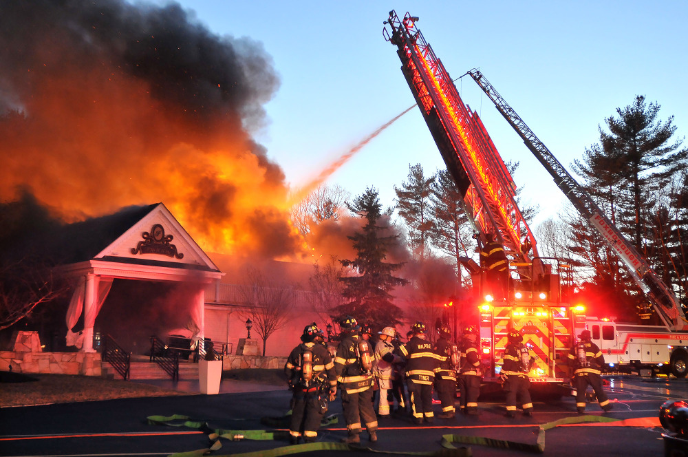 Firefighters respond to a multiple alarm fire at the popular Lakeview Pavilion in Foxboro, Mass., on Saturday.