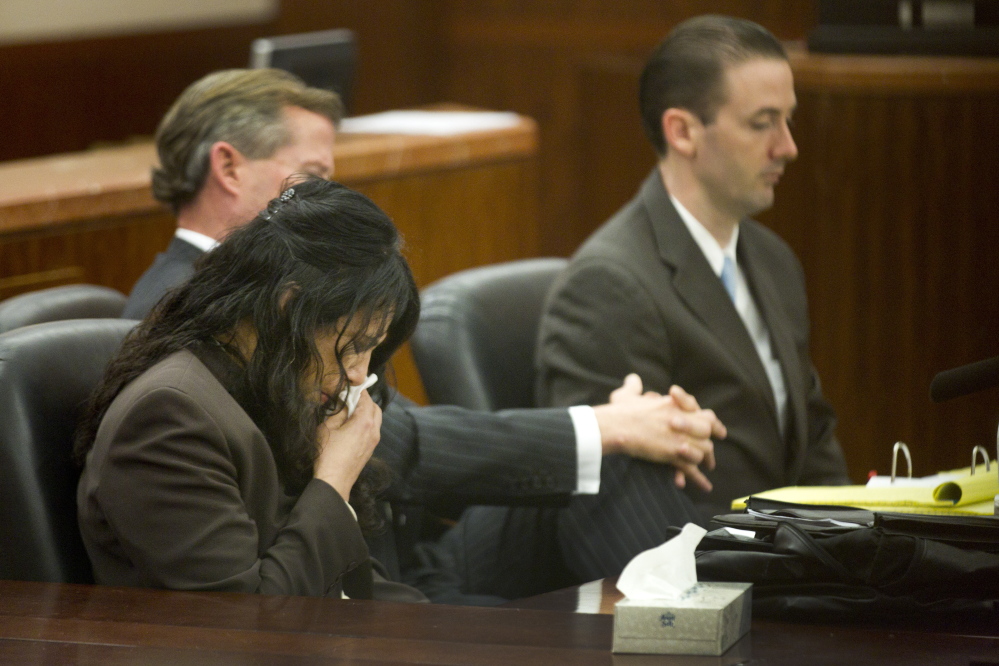 Ana Lilia Trujillo, left, reacts to hearing a 911 call during her trial last week in Houston.