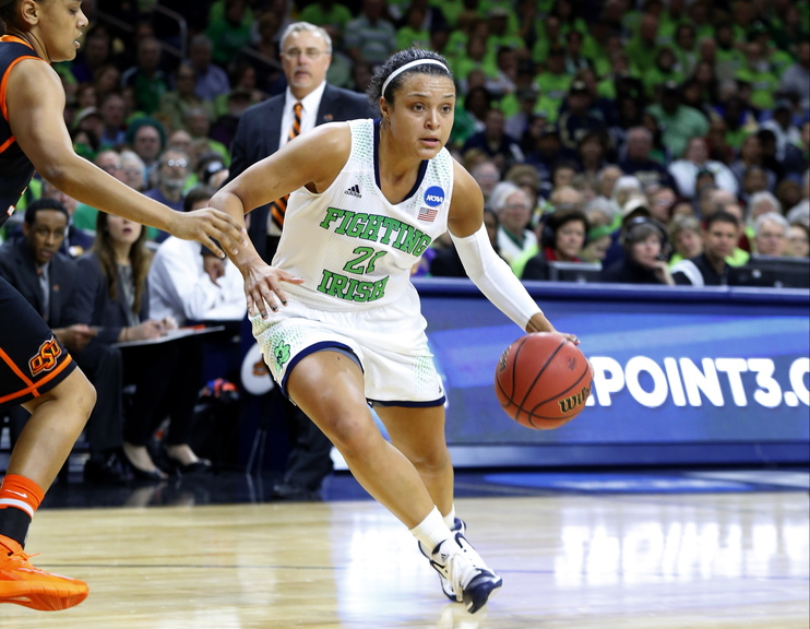 Notre Dame guard Kayla McBride (21) drives against Oklahoma State during the first half of their NCAA women’s college basketball tournament regional semifinal at the Purcell Pavilion in South Bend, Ind.