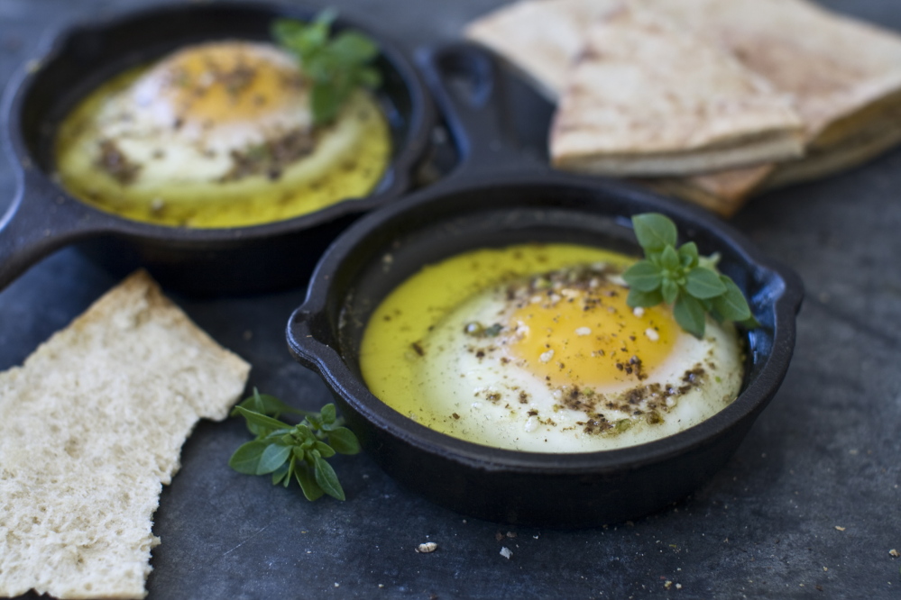 Oven eggs with olive oil and dukkah, an Egyptian seasoning made from ground spices and nuts, go well with any bread.